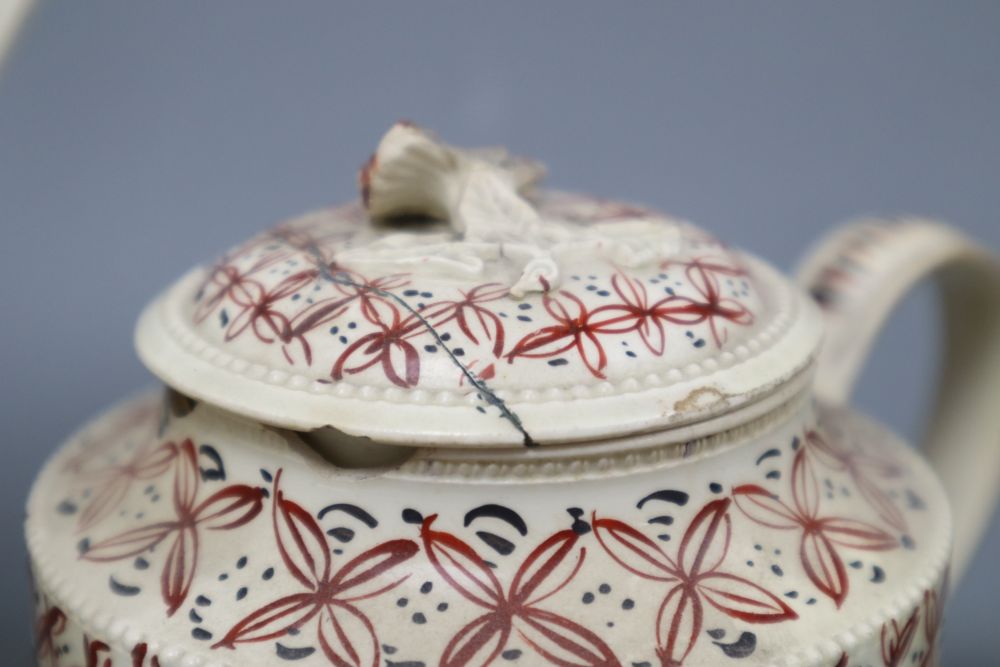 A late 18th century Leeds type creamware coffee pot and cover, an enamelled teapot and cover and a pearlware harvest jug, tallest 28c